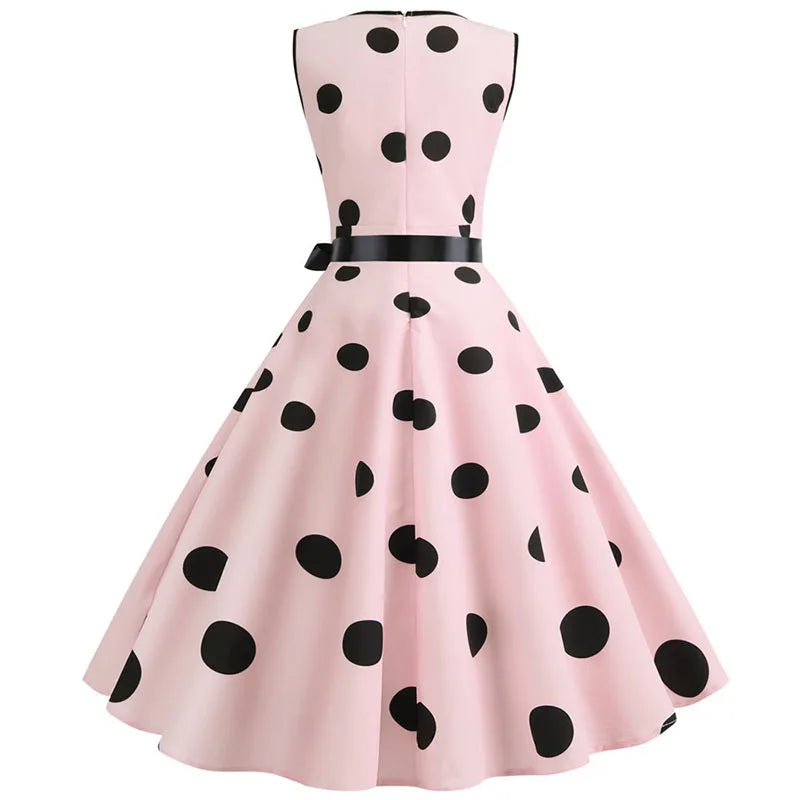 Robe vintage rose à pois noirs